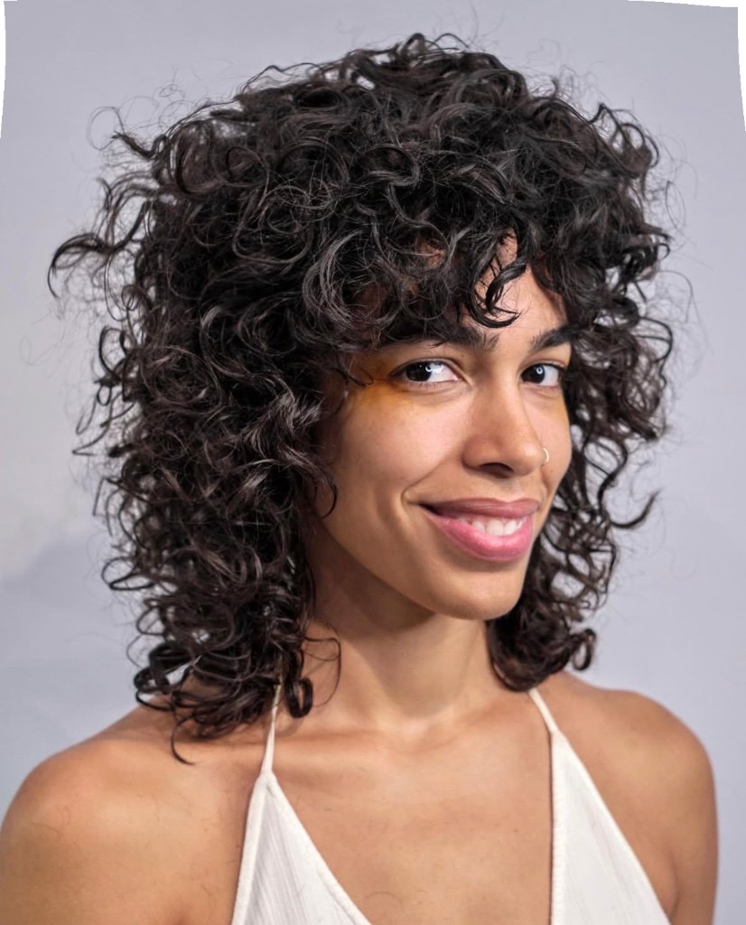 soft curly haircut with natural movement